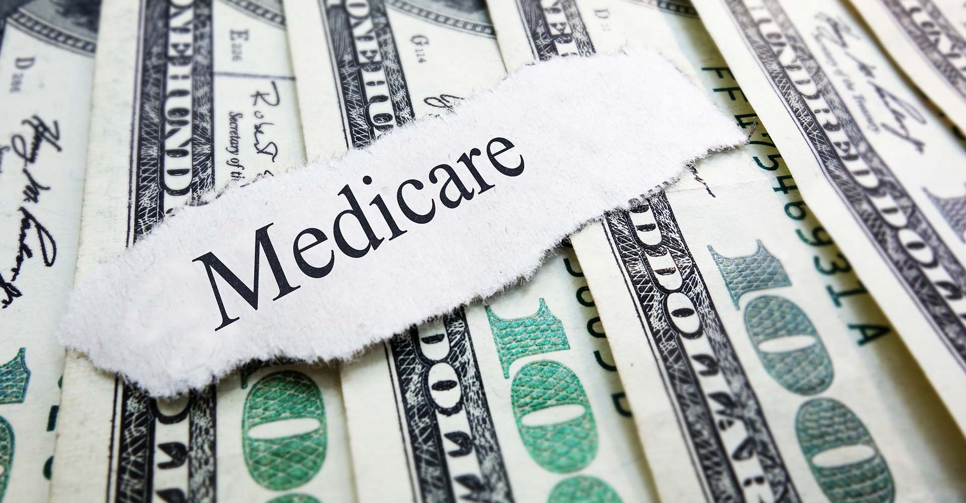 cash with the word Medicare torn out