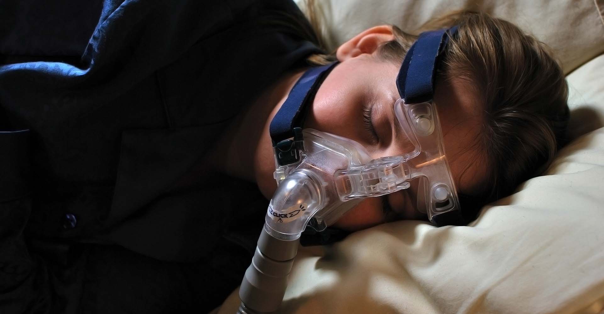 Man sleeping with cpap mask
