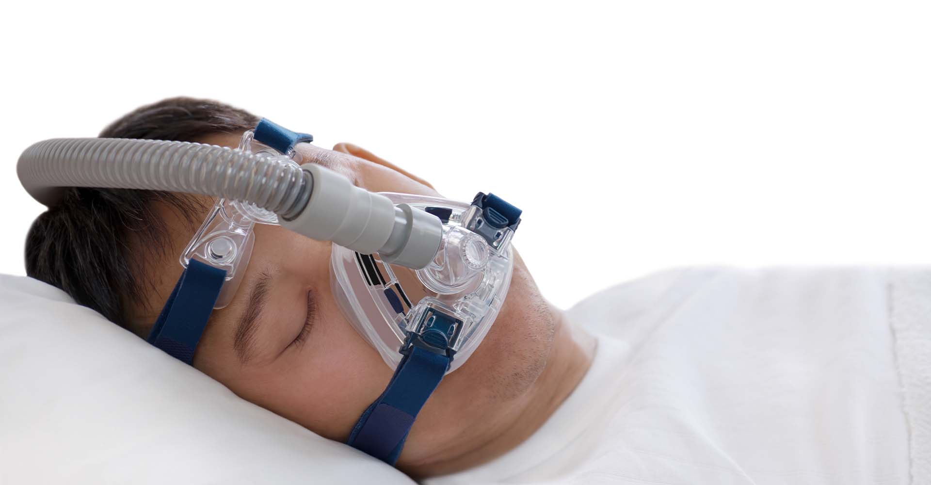 man sleeping peacefully while wearing cpap