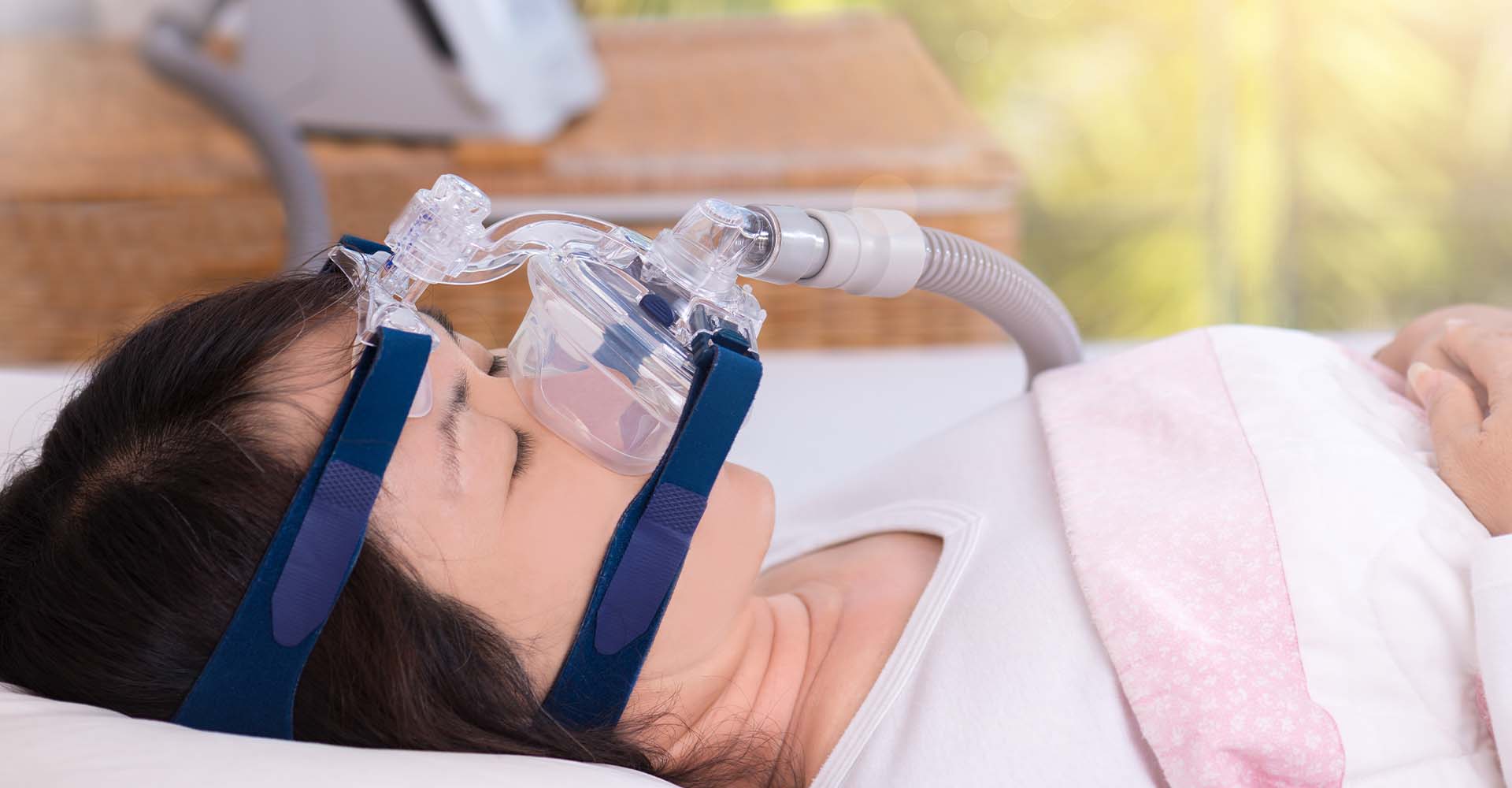 woman sleeping with a cpap